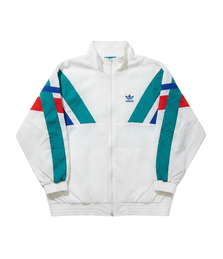 Chaqueta vintage Adidas Originals de los 80 en blanco con paneles geométricos en verde azulado, azul marino y rojo.